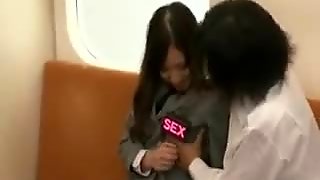 Attractive Japanese schoolgirl has a guy touching her body 