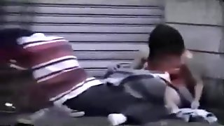 Voyeur tapes an asian girl couple fucking on the pavement in public